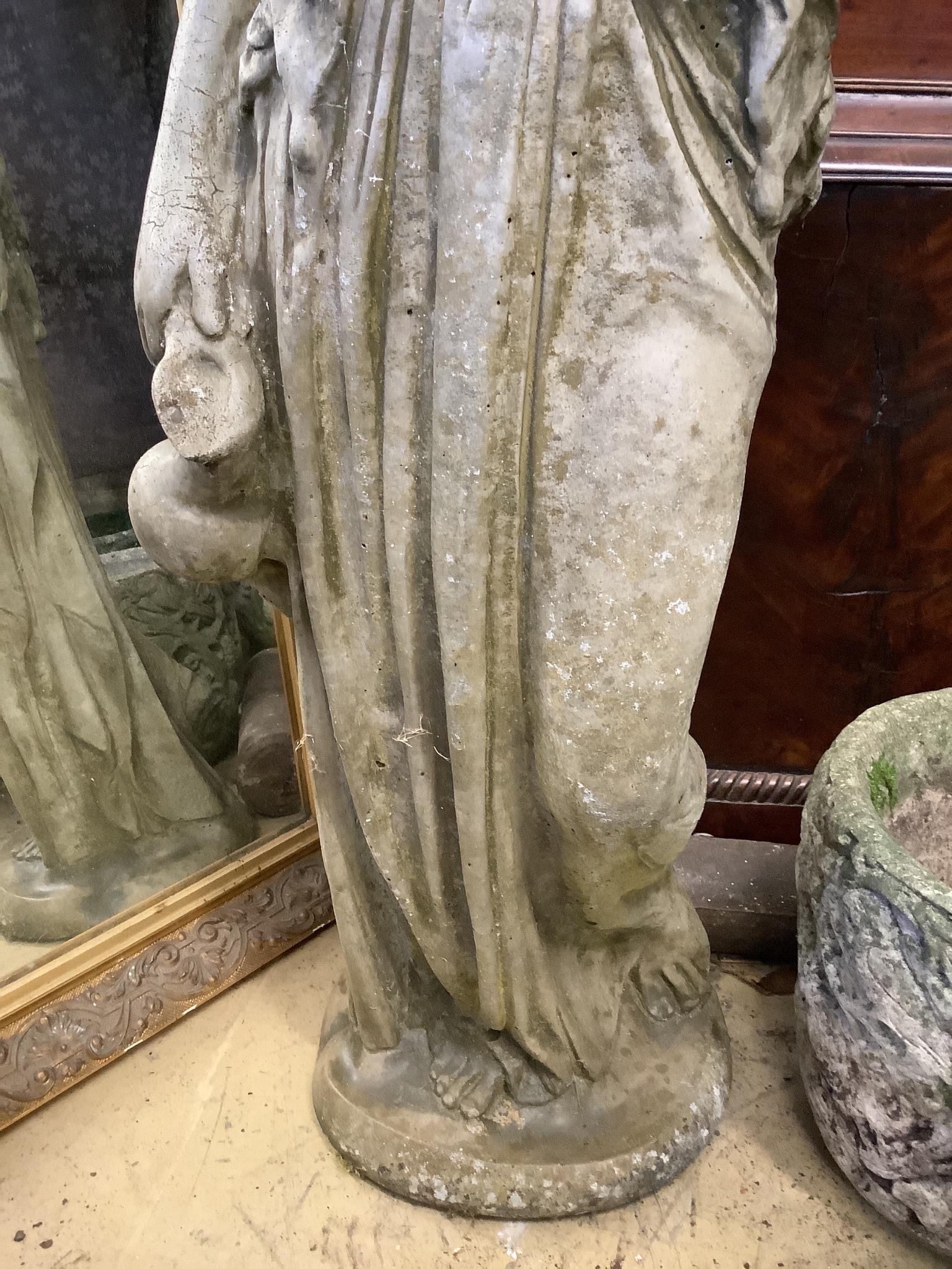 A reconstituted stone garden ornament of a lady with ewer, height 100cm
